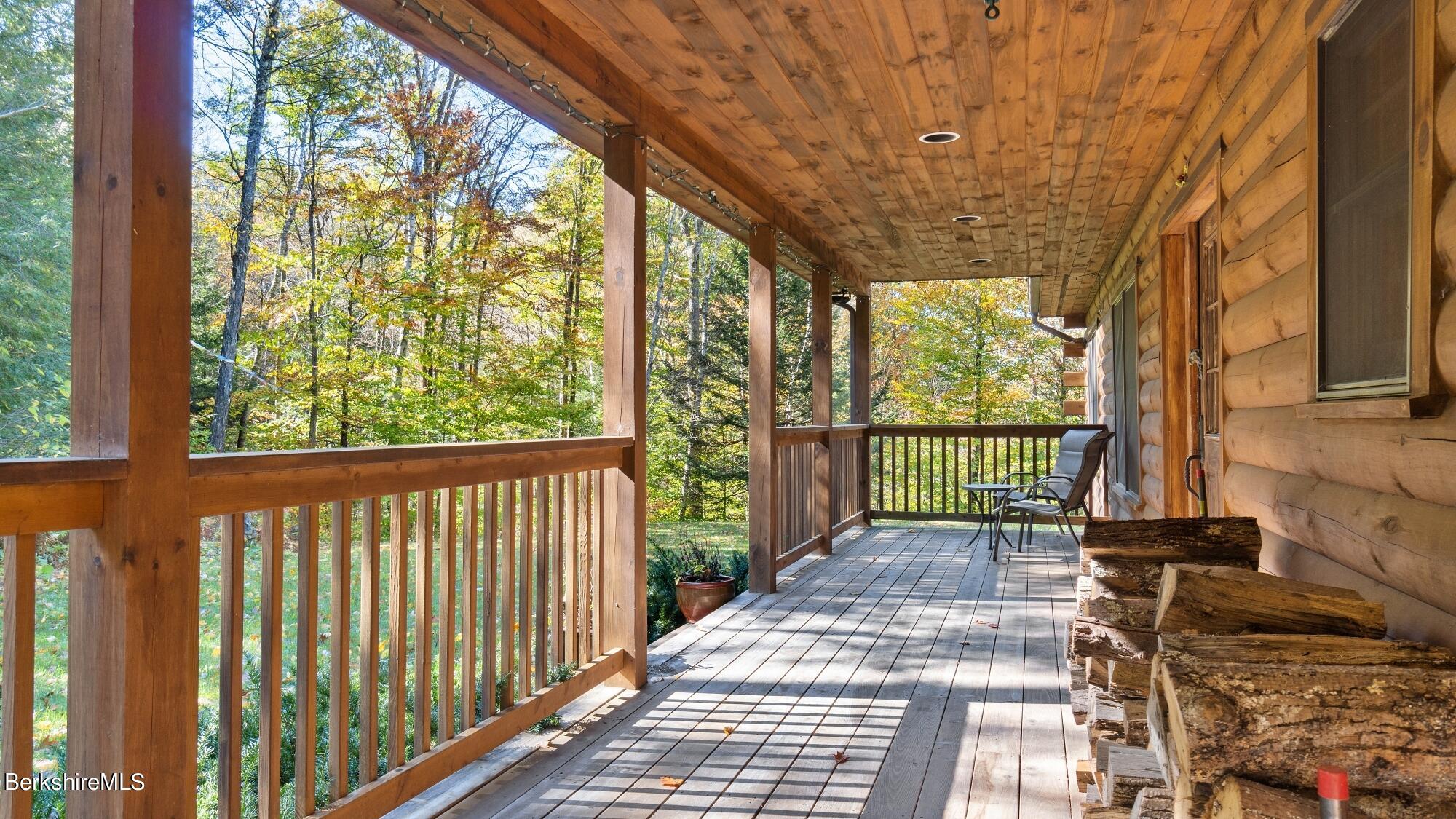 140 Lenox Branch Road Richmond, MA 01254 - Photo 5 of 35 a view of a porch with wooden floor and outdoor space