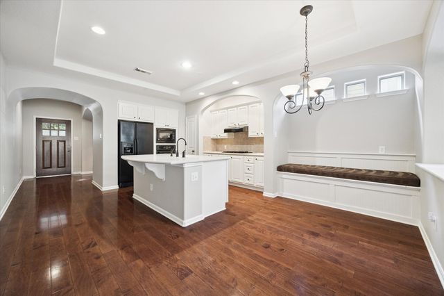 a view of a kitchen with electric appliances
