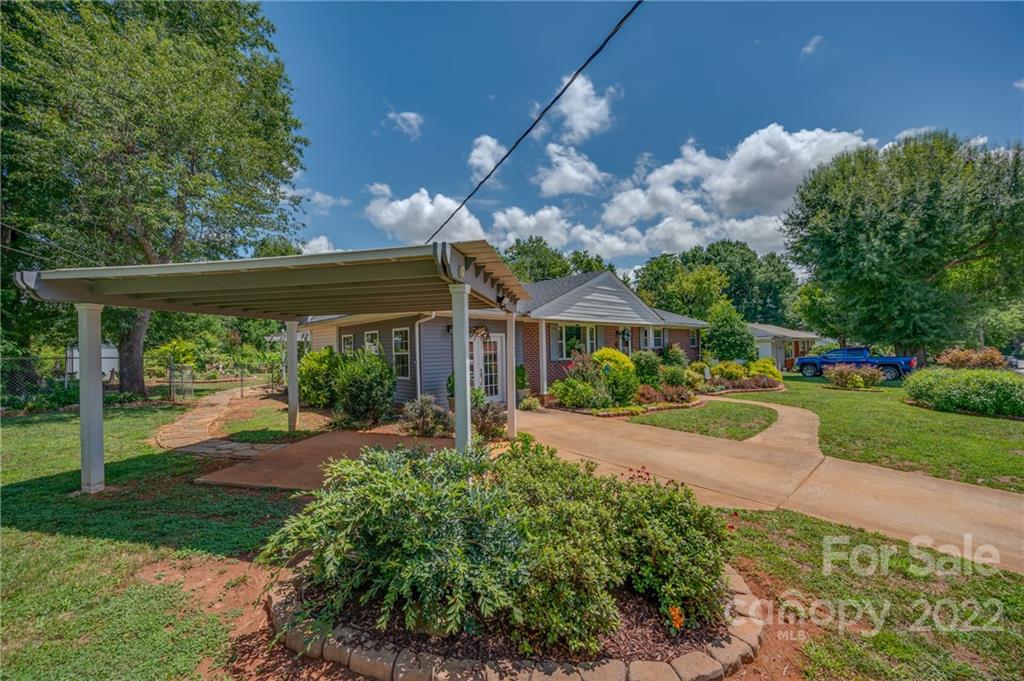 176 Crestview Street Rutherfordton, NC 28139 - Photo 3 of 38 a front view of a house with a yard
