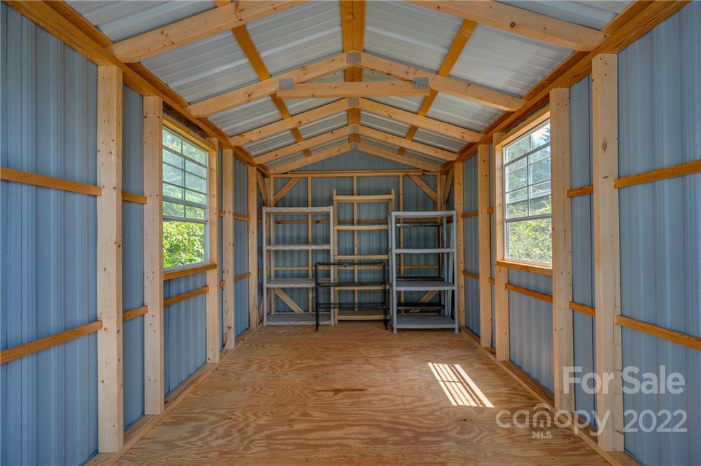 176 Crestview Street Rutherfordton, NC 28139 - Photo 34 of 38 a view of empty room with wooden floor and windows