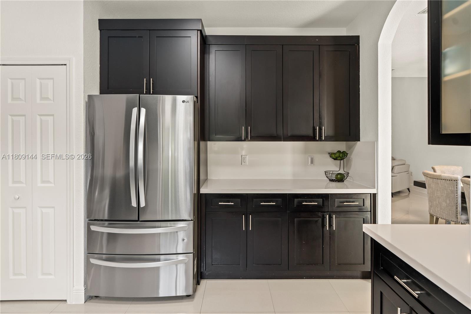 3801 Southwest 149th Avenue Miami, FL 33185 - Photo 15 of 41 a kitchen with a refrigerator and a sink