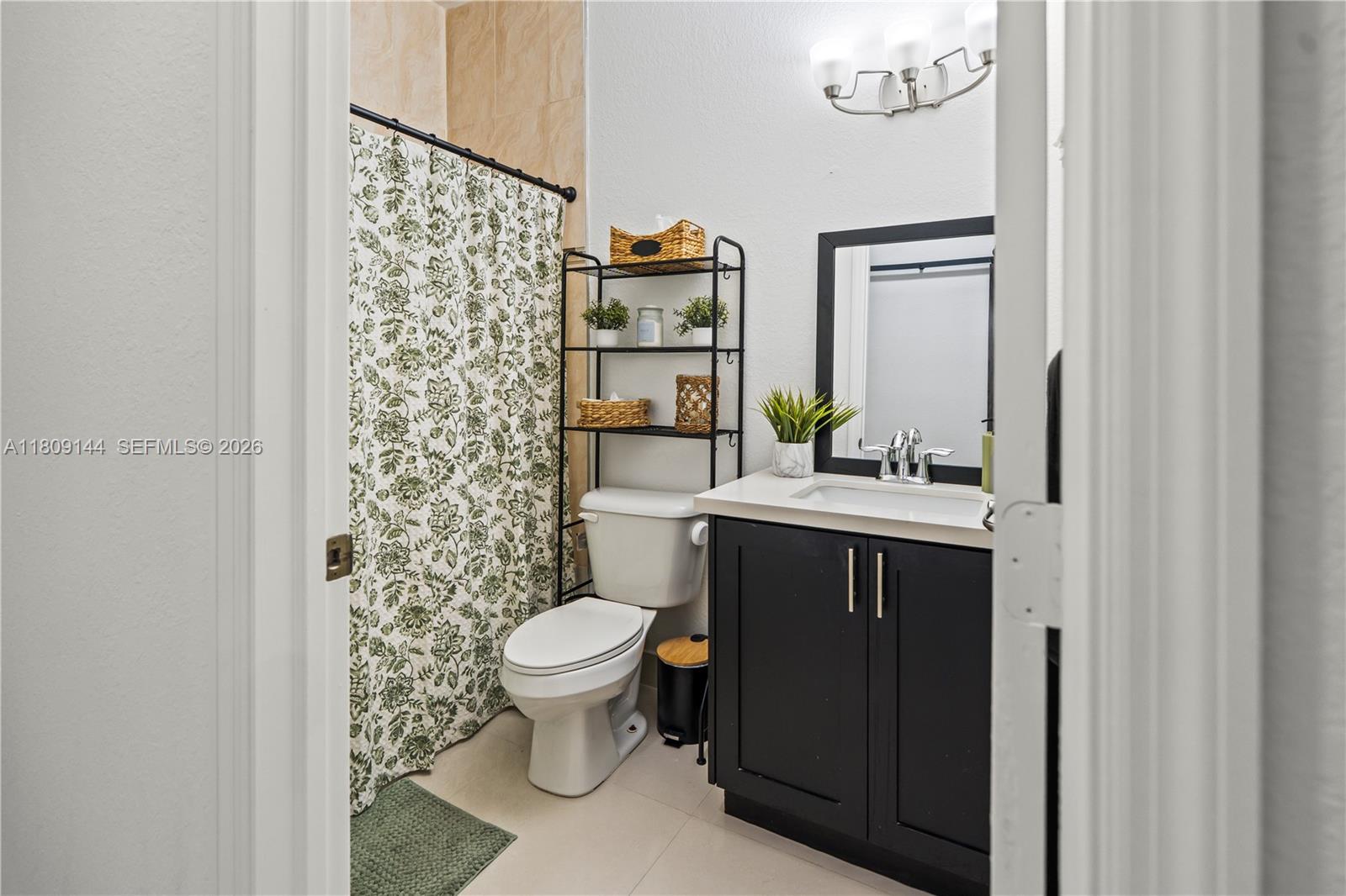 3801 Southwest 149th Avenue Miami, FL 33185 - Photo 18 of 41 a bathroom with a sink and a toilet
