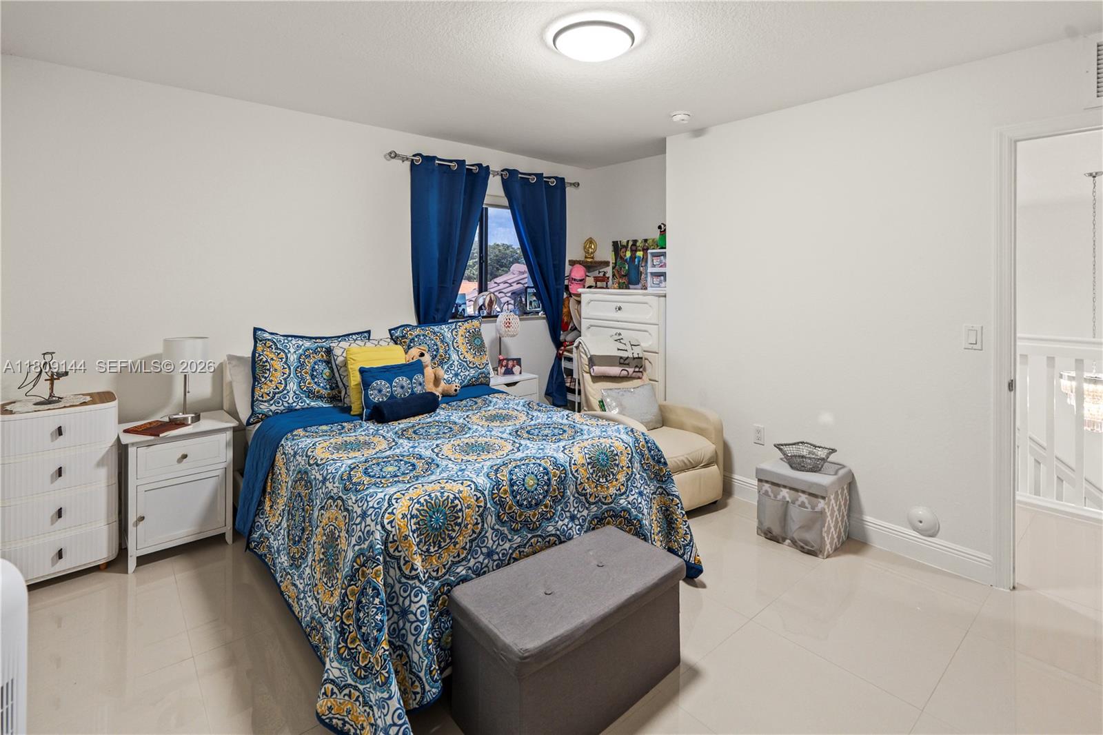 3801 Southwest 149th Avenue Miami, FL 33185 - Photo 19 of 41 a bed room with a bed and a window