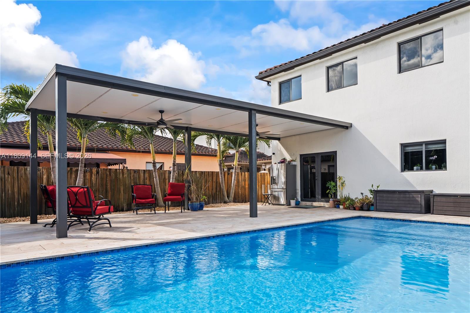 3801 Southwest 149th Avenue Miami, FL 33185 - Photo 2 of 41 a view of swimming pool with outdoor seating