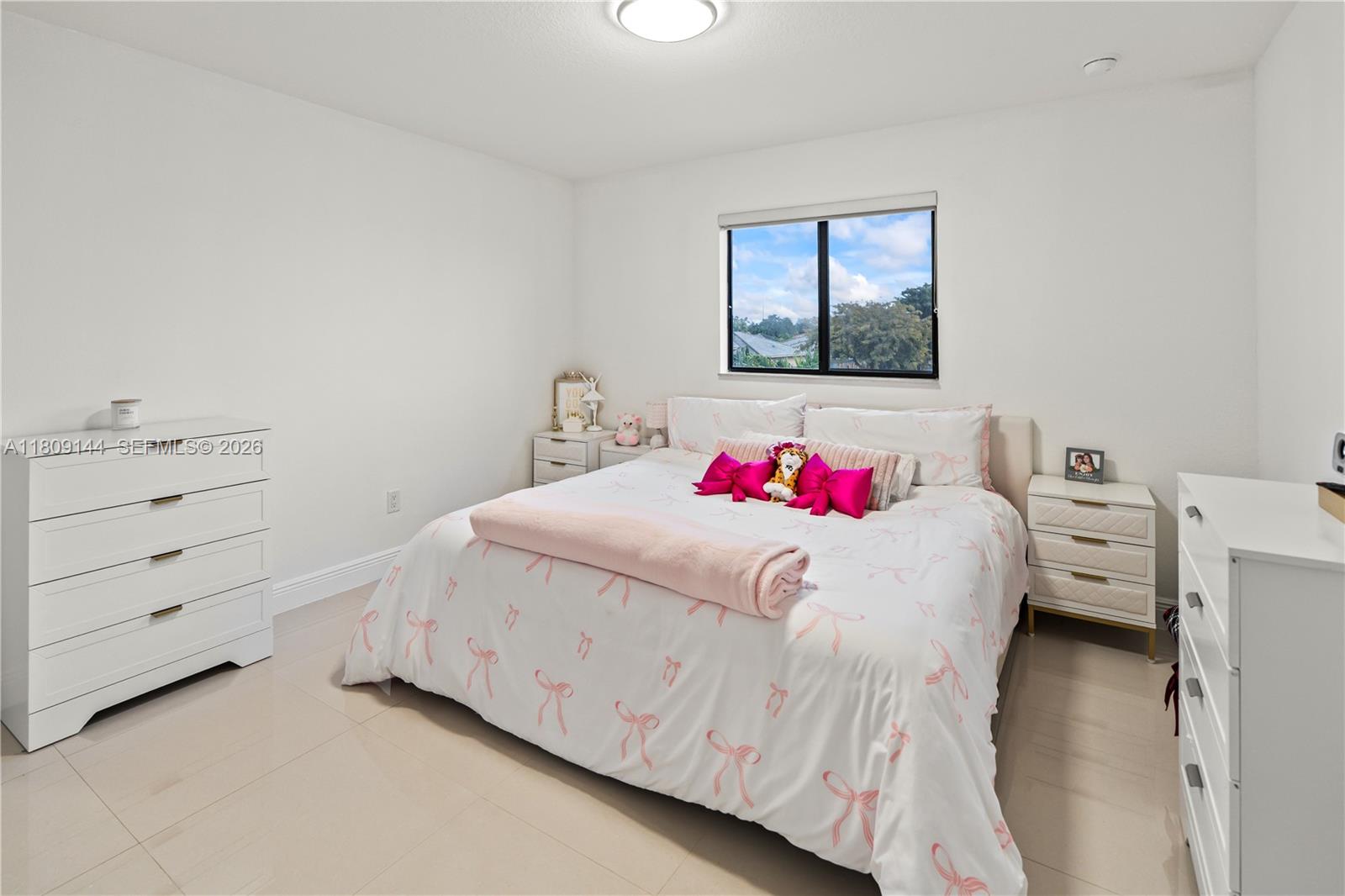 3801 Southwest 149th Avenue Miami, FL 33185 - Photo 21 of 41 a bedroom with a bed and a dresser