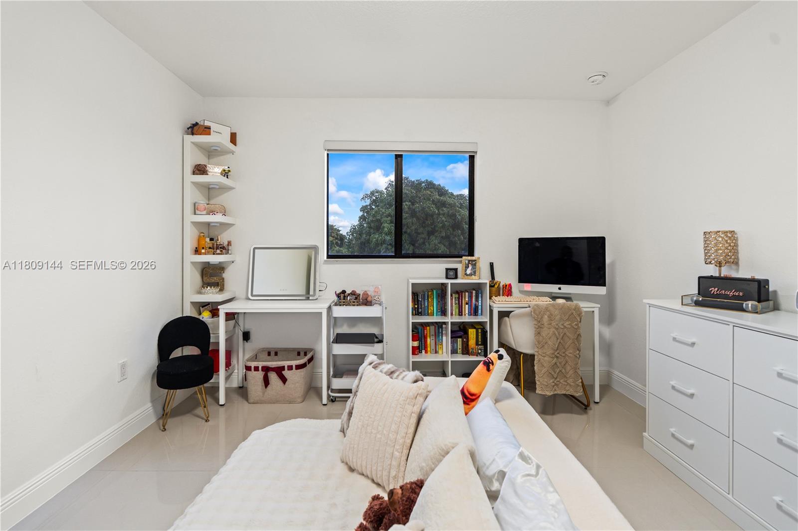 3801 Southwest 149th Avenue Miami, FL 33185 - Photo 28 of 41 a view of a livingroom with workspace and a window