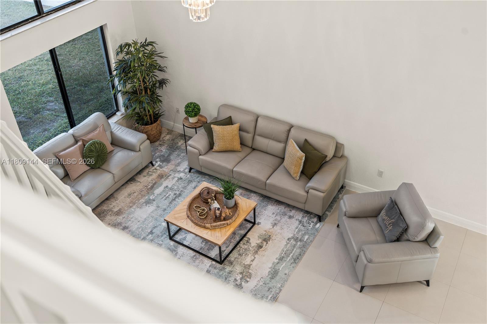 3801 Southwest 149th Avenue Miami, FL 33185 - Photo 29 of 41 a living room with furniture and a potted plant
