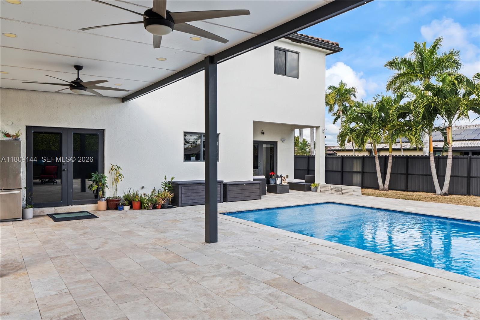3801 Southwest 149th Avenue Miami, FL 33185 - Photo 3 of 41 a view of a patio with a table and chairs