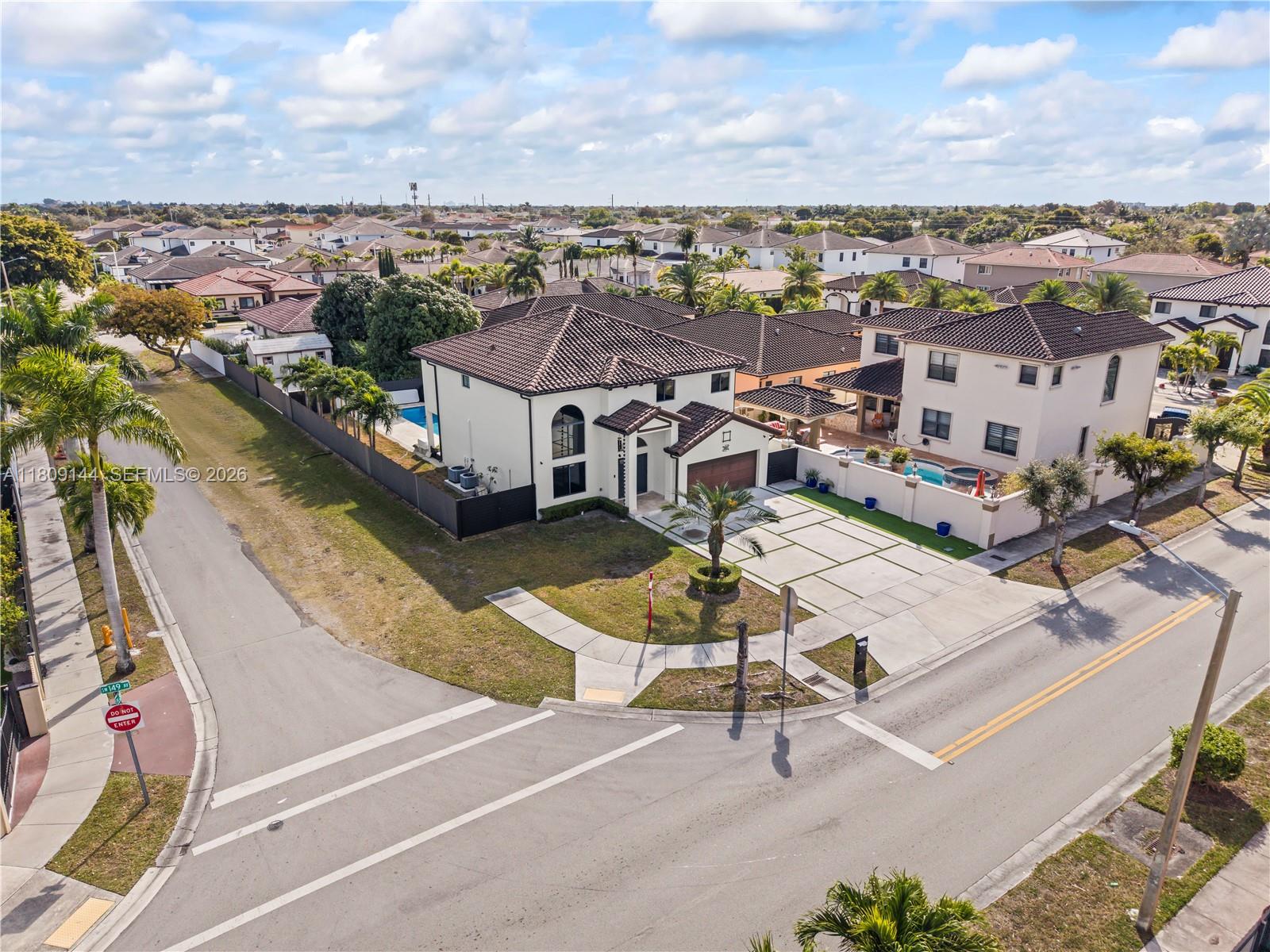 3801 Southwest 149th Avenue Miami, FL 33185 - Photo 32 of 41 an aerial view of a house with outdoor space and ocean view