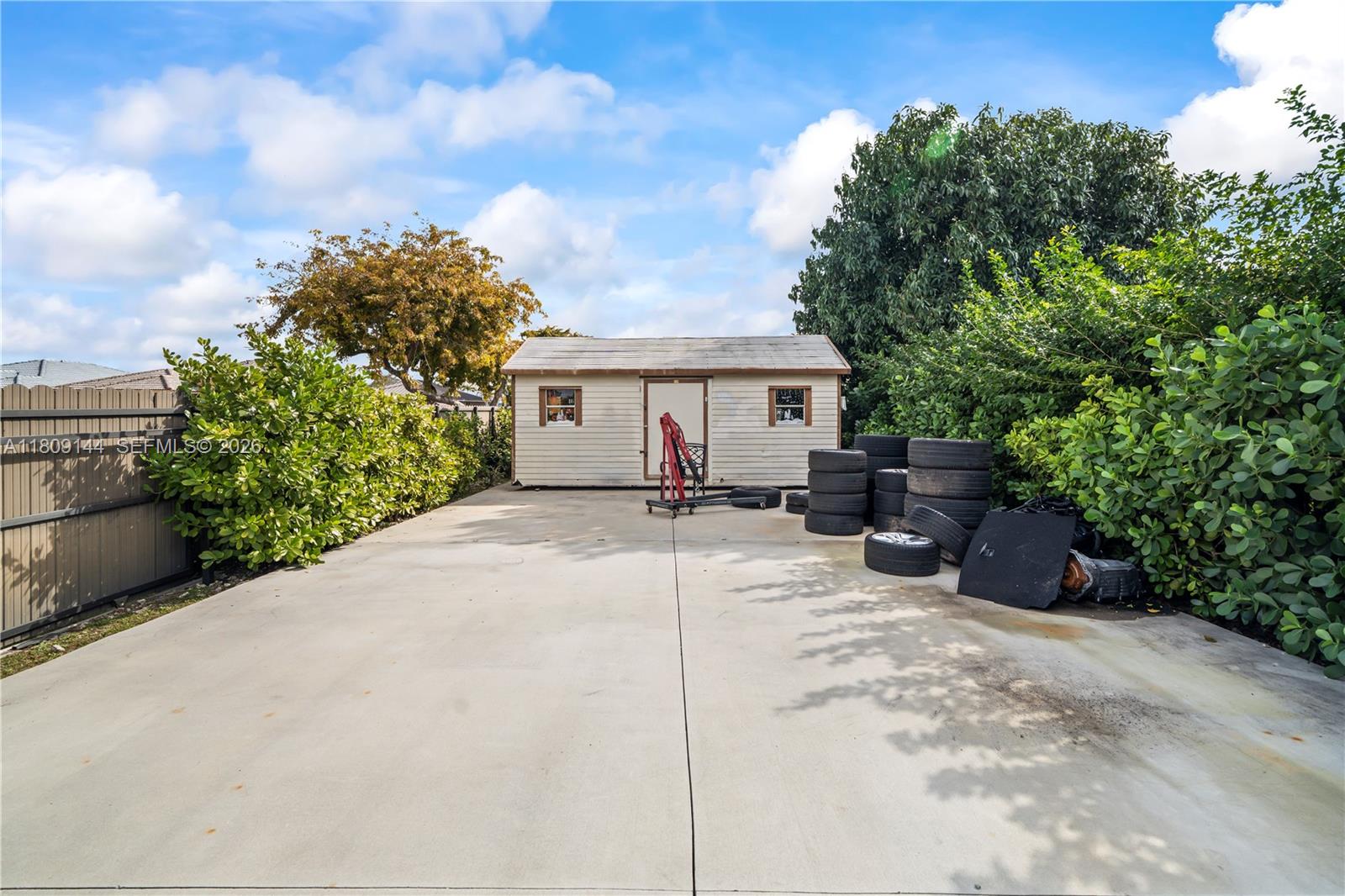 3801 Southwest 149th Avenue Miami, FL 33185 - Photo 4 of 41 a house view with a outdoor space