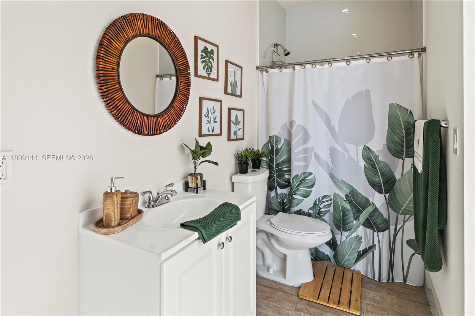 3801 Southwest 149th Avenue Miami, FL 33185 - Photo 8 of 41 a bathroom with a sink a toilet and a mirror