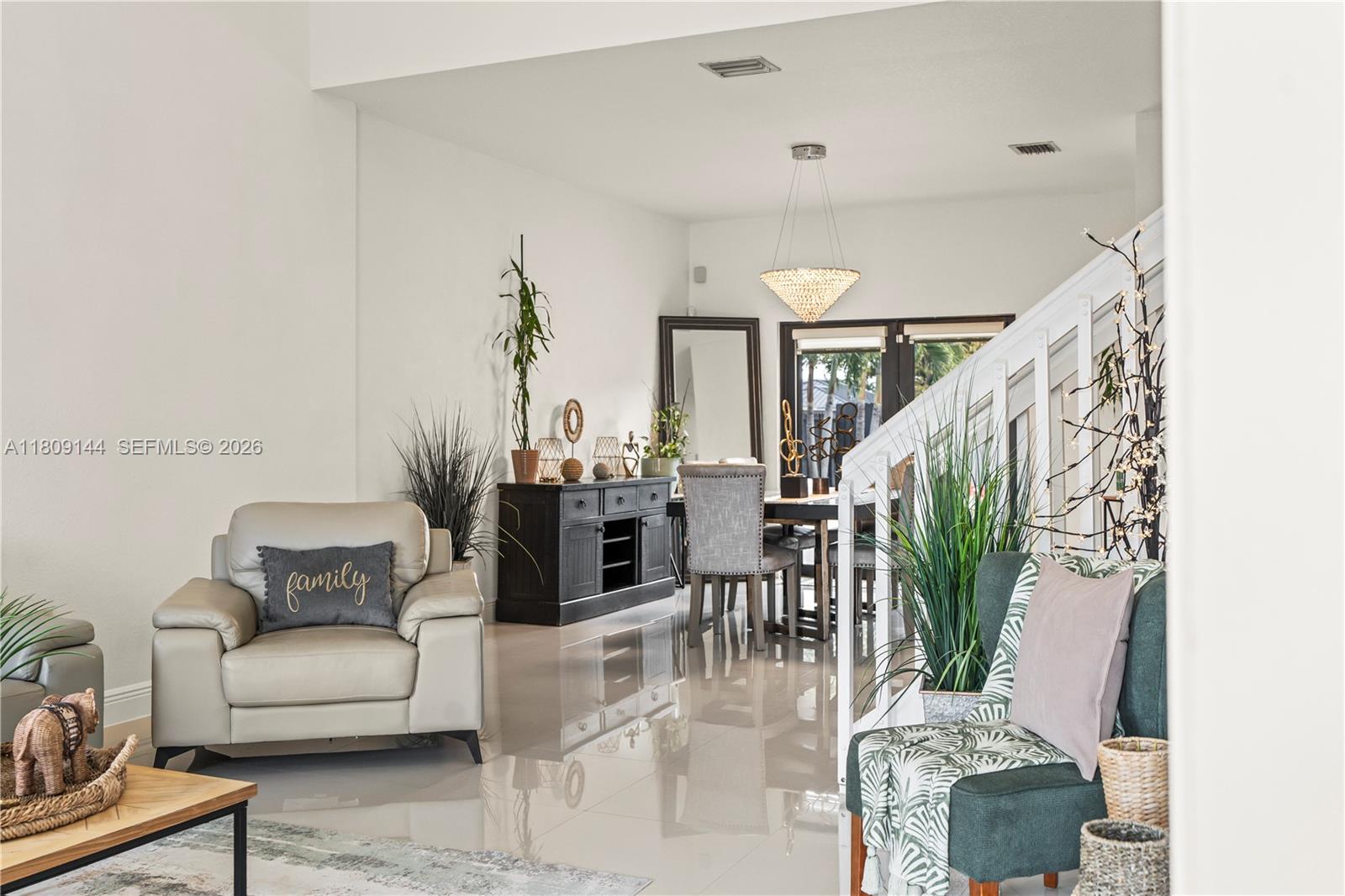 3801 Southwest 149th Avenue Miami, FL 33185 - Photo 9 of 41 a living room with furniture and wooden floor