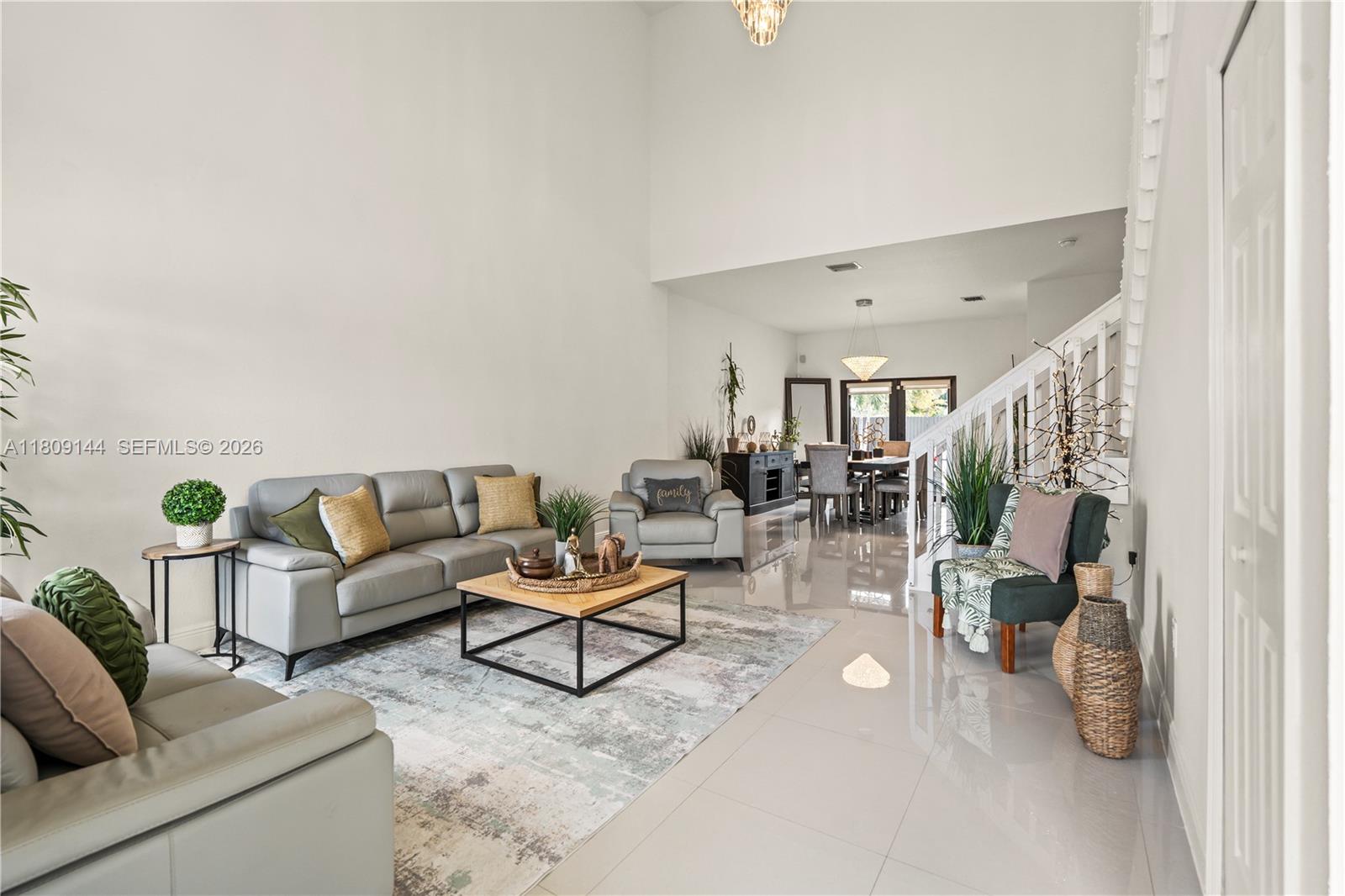 3801 Southwest 149th Avenue Miami, FL 33185 - Photo 10 of 41 a living room with furniture and a couch