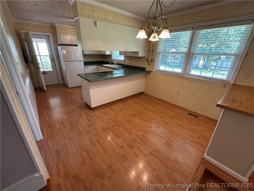 3120 Hampstead Road Lumberton, NC 28360 - Photo 15 of 30 a kitchen with sink refrigerator and window