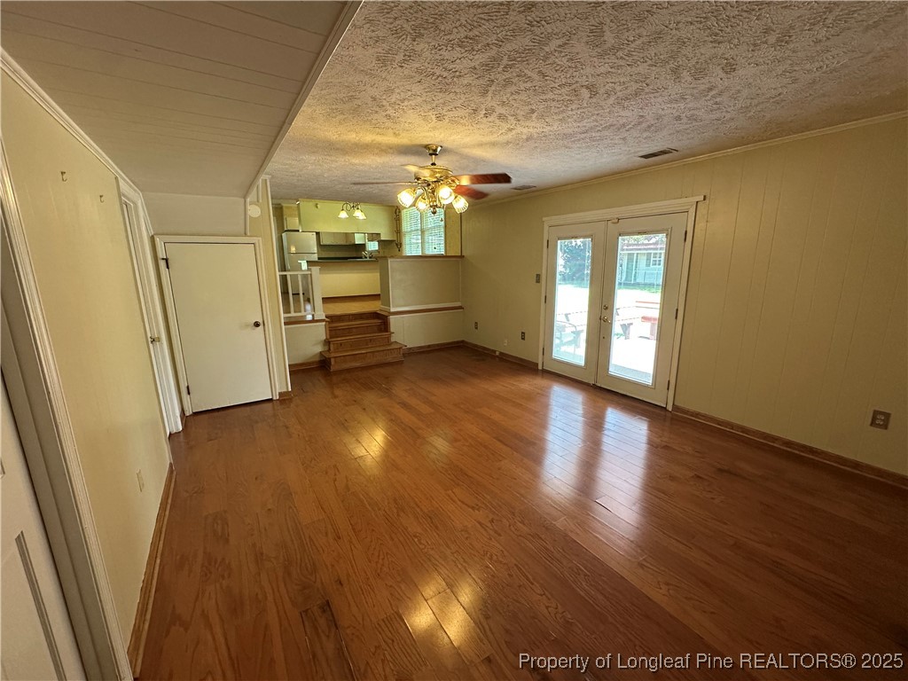 3120 Hampstead Road Lumberton, NC 28360 - Photo 19 of 30 an empty room with wooden floor and windows