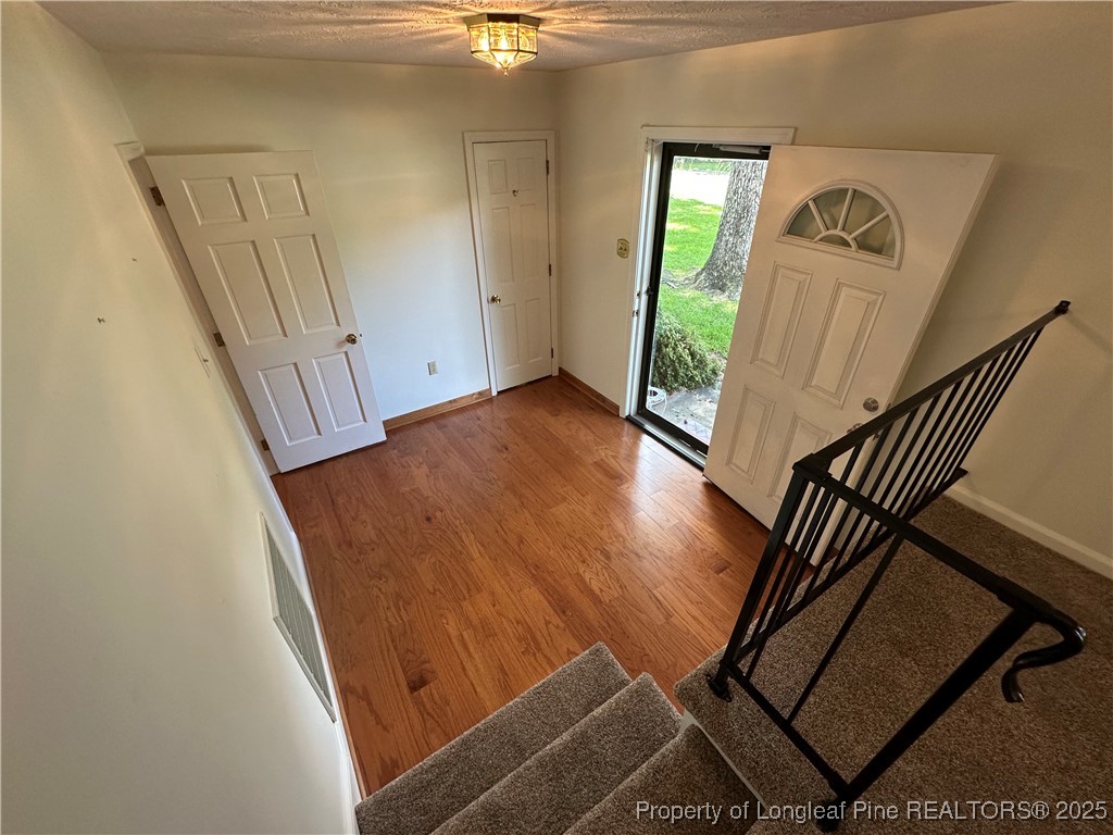 3120 Hampstead Road Lumberton, NC 28360 - Photo 25 of 30 an entryway in a hall with wooden floor