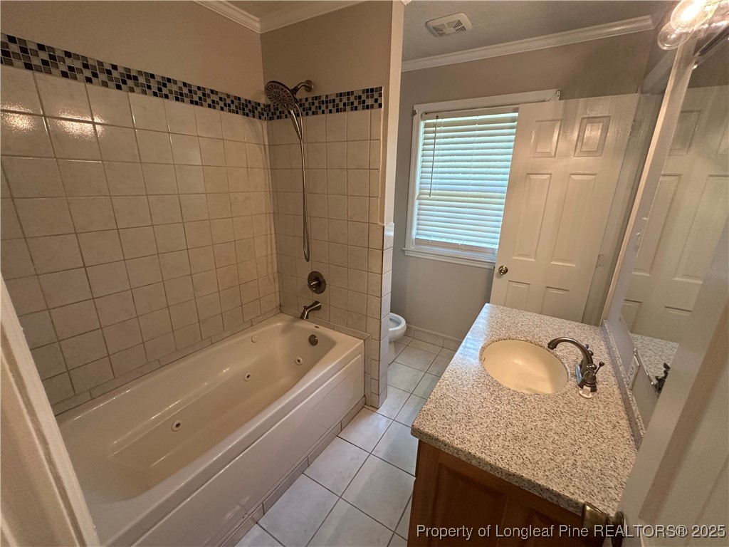 3120 Hampstead Road Lumberton, NC 28360 - Photo 27 of 30 a bathroom with a granite countertop sink a toilet and bathtub