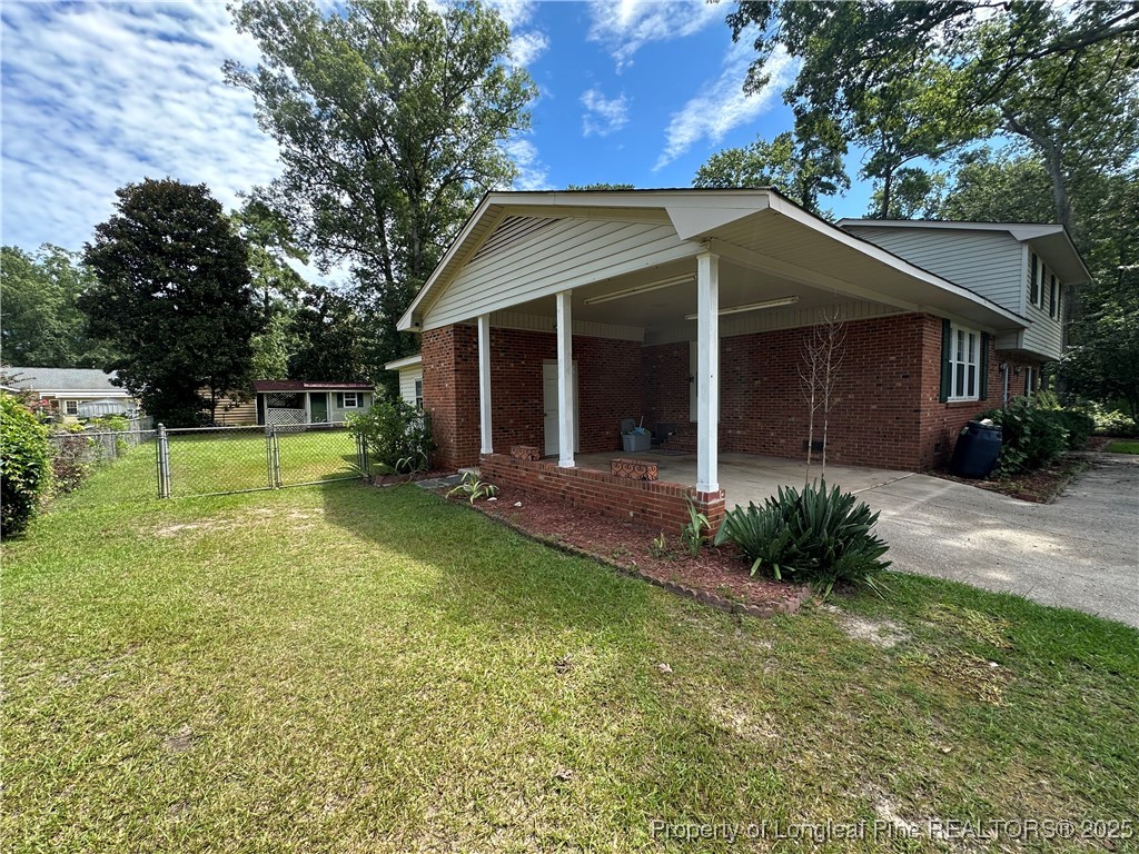 3120 Hampstead Road Lumberton, NC 28360 - Photo 4 of 30 a view of a house with backyard and garden