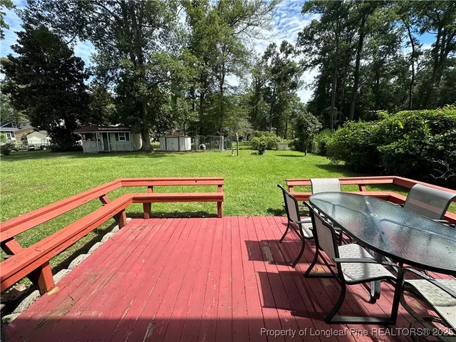 a view of a chairs and table on the garden