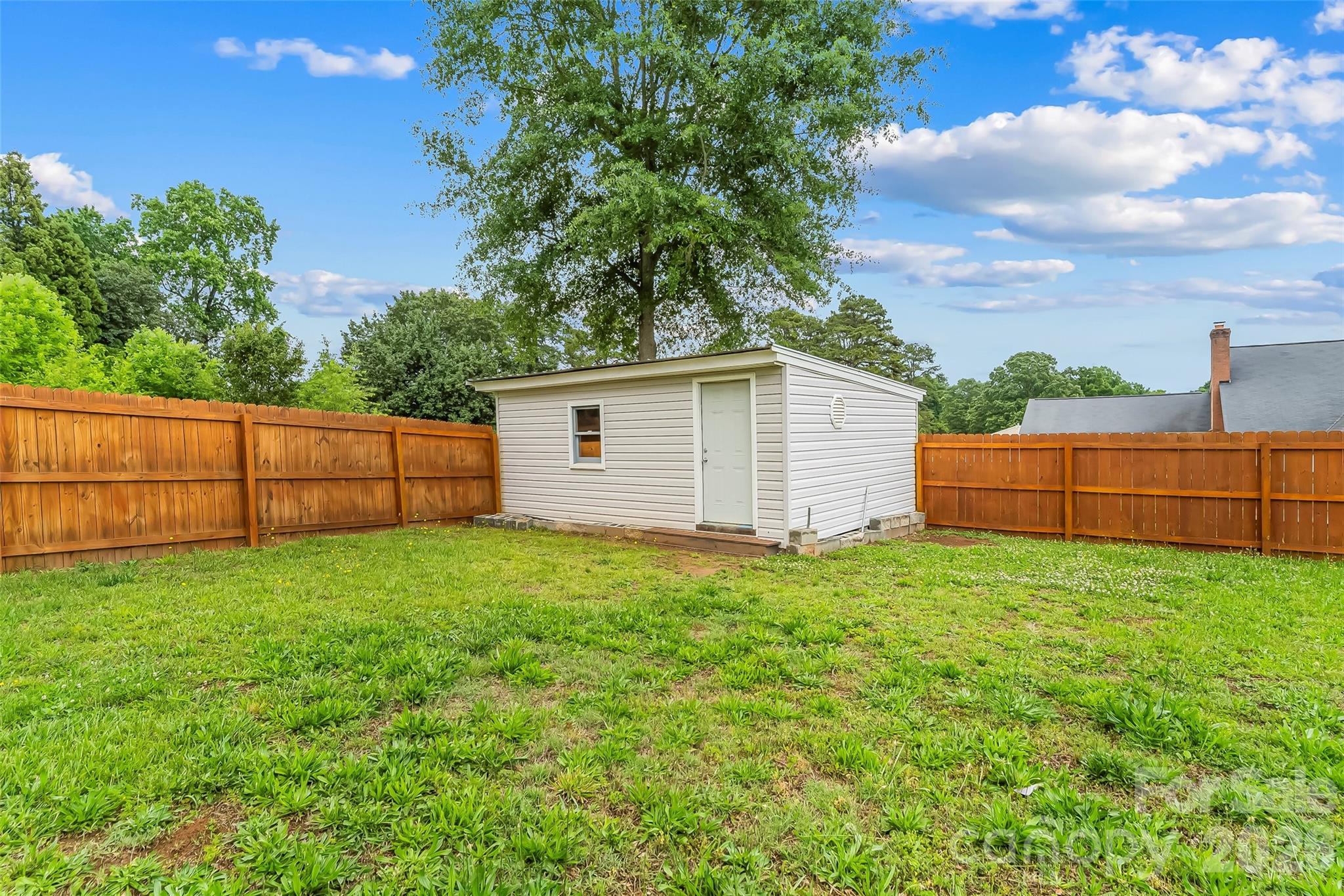 3511 Randleman Road Iron Station, NC 28080 - Photo 25 of 31 a view of a backyard with potted plants and large tree
