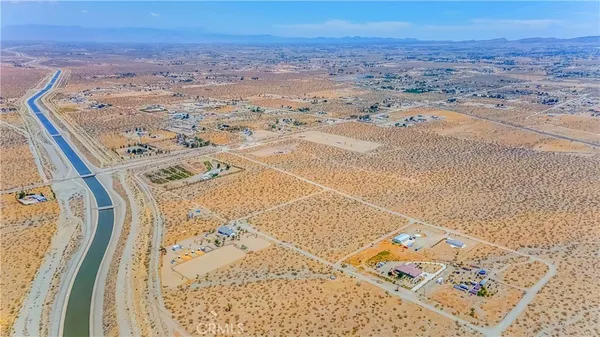 a living room with furniture a rug and a large window