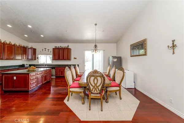 a large kitchen with lots of counter space and stainless steel appliances