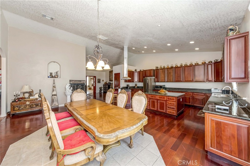 3789 Luna Road Phelan, CA 92371 - Photo 23 of 67 a living room with lots of furniture and kitchen view
