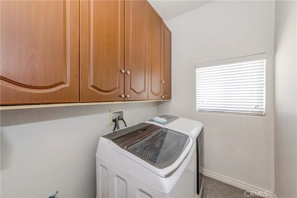 3789 Luna Road Phelan, CA 92371 - Photo 32 of 67 a utility room with a sink a washer and dryer