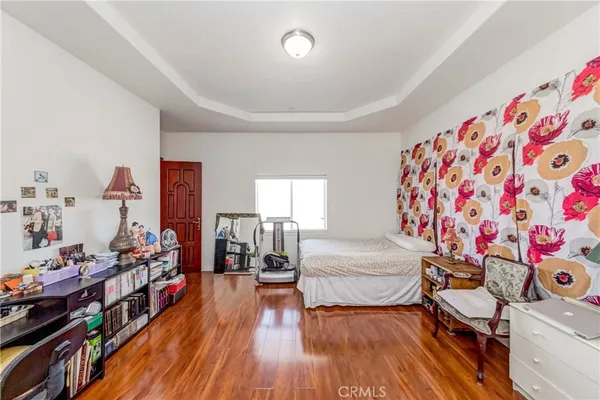 a view of walk in closet with clothes