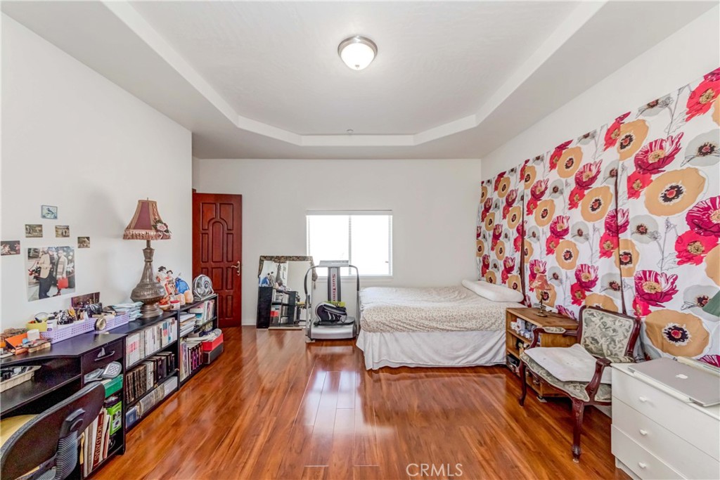 3789 Luna Road Phelan, CA 92371 - Photo 34 of 67 a bedroom with furniture and a wooden floor