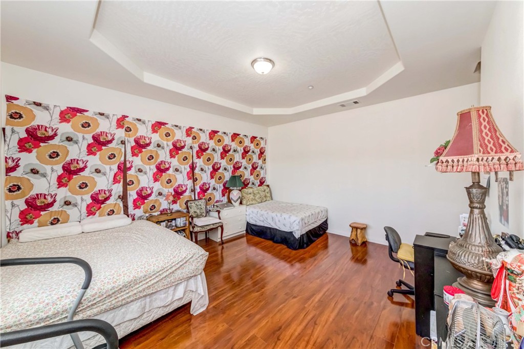 3789 Luna Road Phelan, CA 92371 - Photo 35 of 67 a room with furniture and a wooden floor