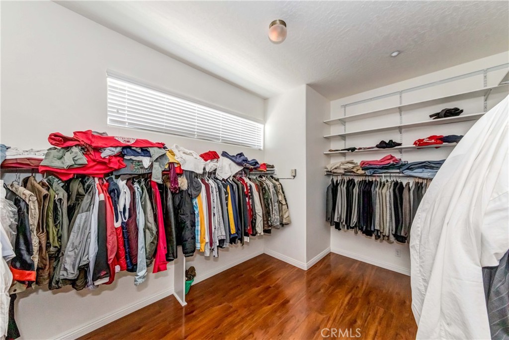 3789 Luna Road Phelan, CA 92371 - Photo 41 of 67 a view of walk in closet with clothes