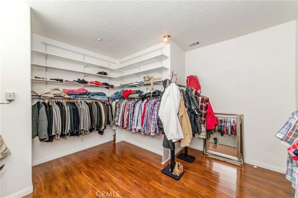 3789 Luna Road Phelan, CA 92371 - Photo 42 of 67 a view of walk in closet with clothes and shoes