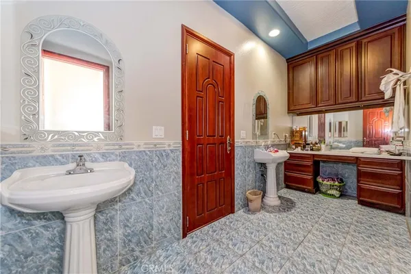 a view of a patio with a table and chairs under an umbrella
