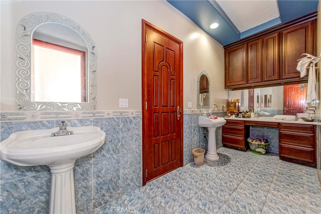 3789 Luna Road Phelan, CA 92371 - Photo 50 of 67 a bathroom with a sink and a mirror