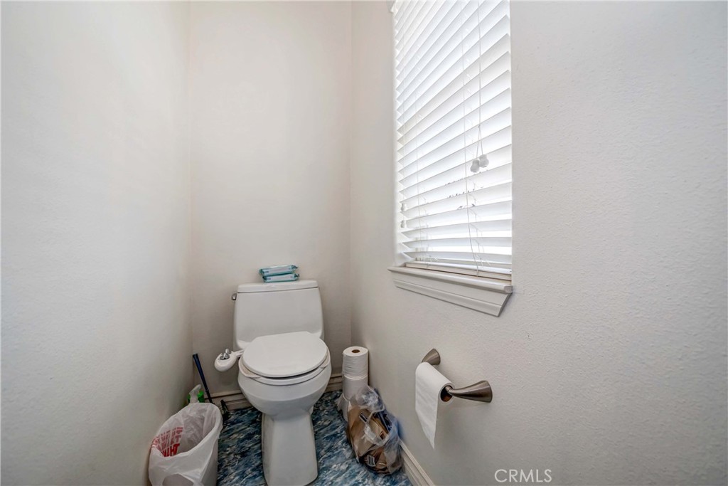 3789 Luna Road Phelan, CA 92371 - Photo 51 of 67 a bathroom with a toilet and a sink