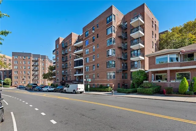 a city street lined with buildings and trees