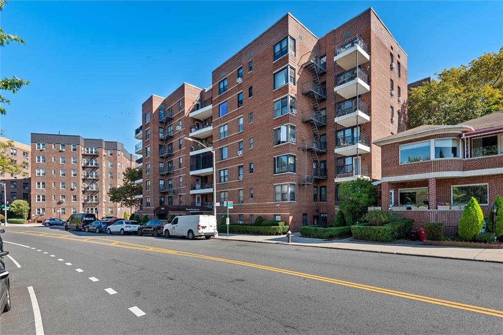 a city street lined with buildings and trees