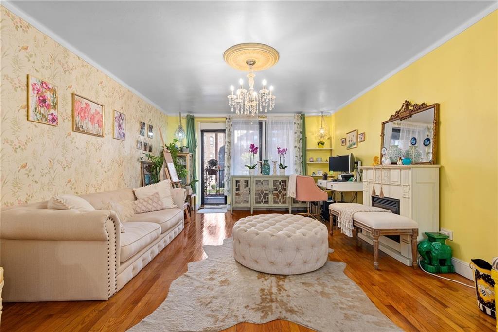 7401 Shore Road, Unit 1E Brooklyn, NY 11209 - Photo 7 of 21 a living room with furniture chandelier and a chandelier