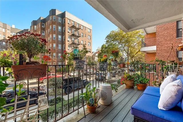 a view of balcony with seating space and potted plants