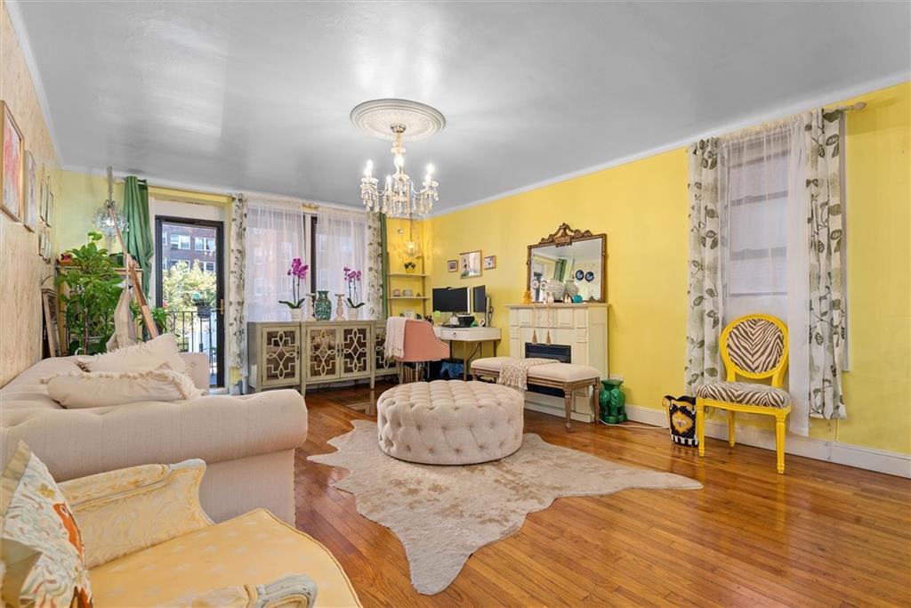 7401 Shore Road, Unit 1E Brooklyn, NY 11209 - Photo 8 of 21 a living room with furniture and a wooden floor