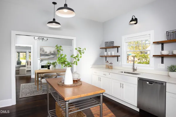 a kitchen with a table and chairs in it