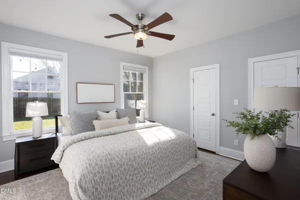 a bedroom with a bed and window