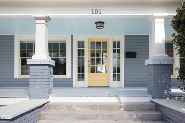 a front view of a house with a garage