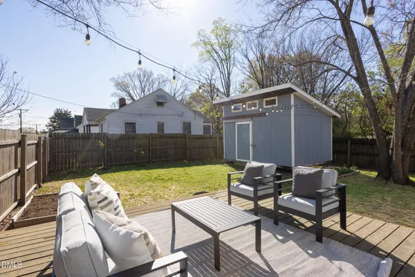 a view of a patio with a yard