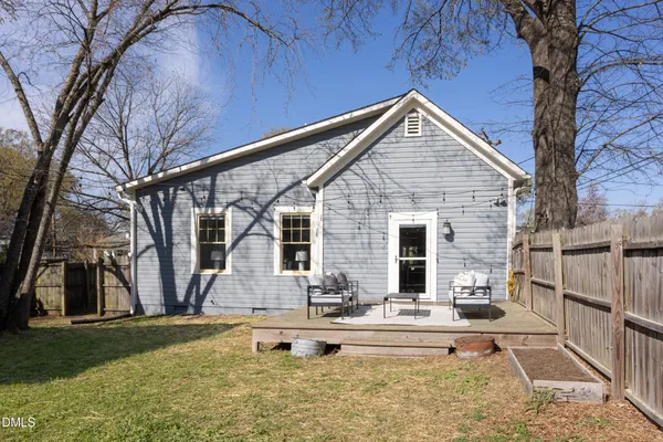 a front view of house with yard and seating area