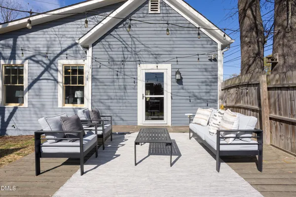 a bench sitting in front of a house