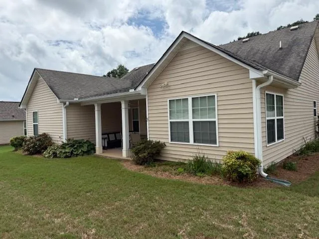 a view of a house with a yard