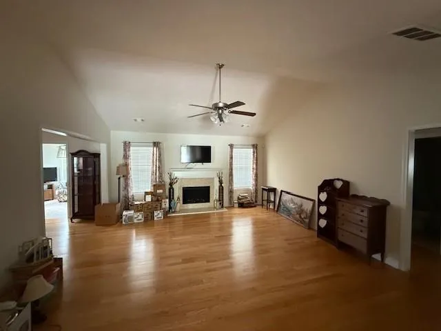 a living room with furniture and fireplace