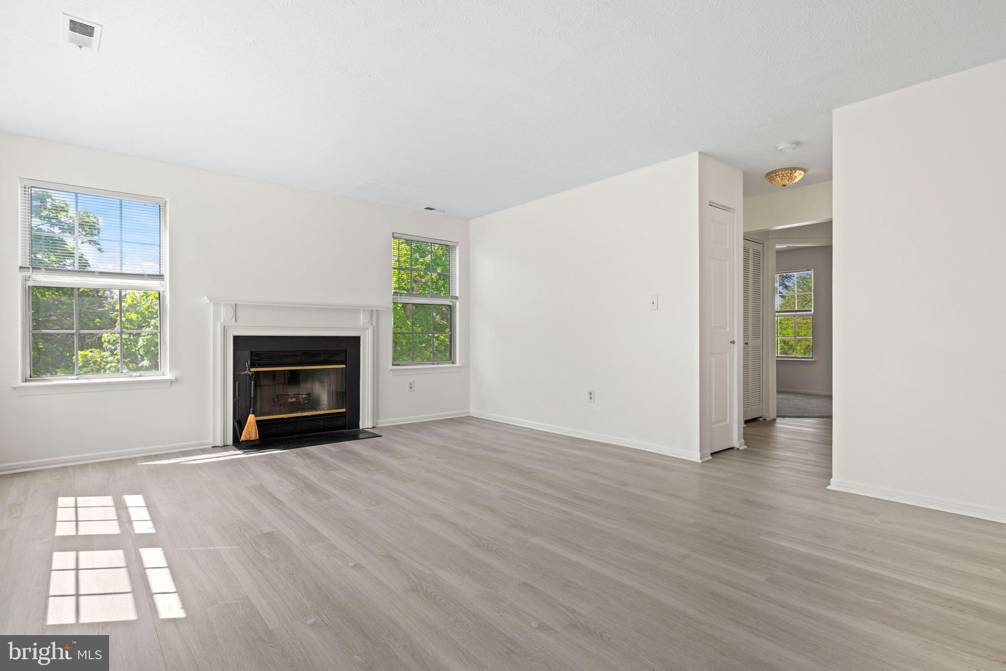 31 Beagle Run, Unit 88 Nottingham, MD 21236 - Photo 14 of 43 an empty room with windows and fireplace